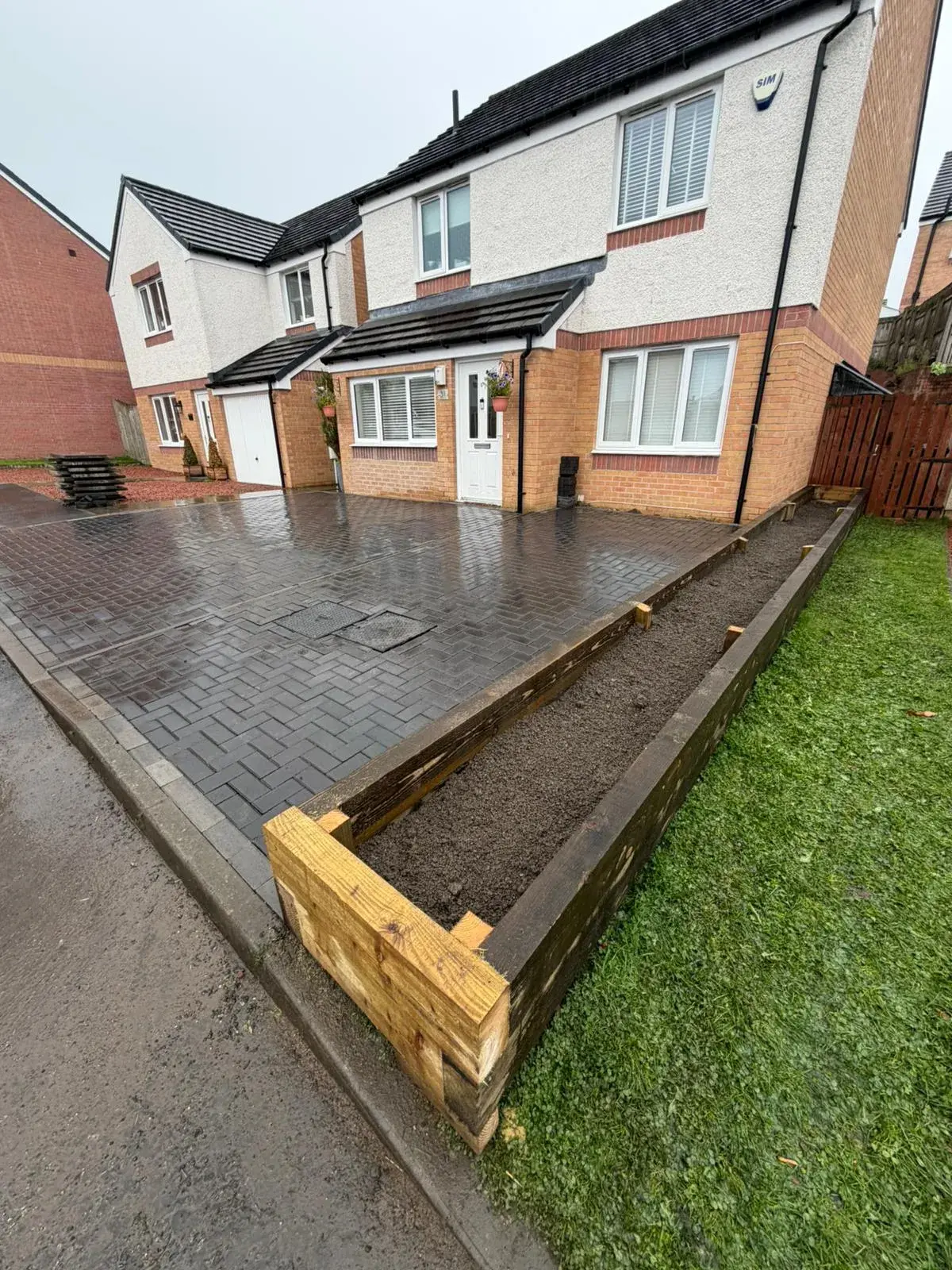 Driveway installation mid-build with edging in place